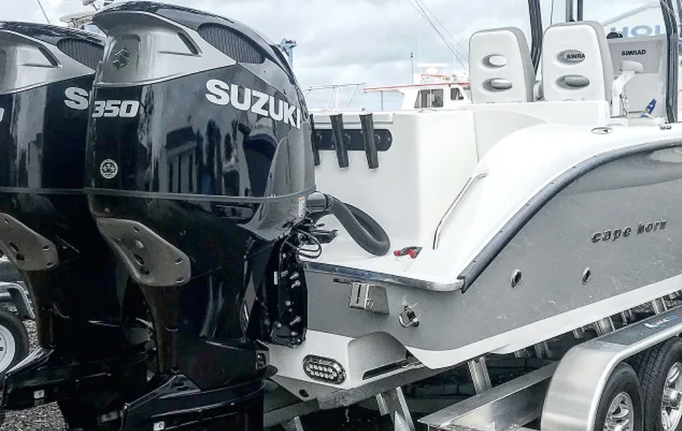 Outboard Pit Crew technician doing mobile Suzuki outboard service