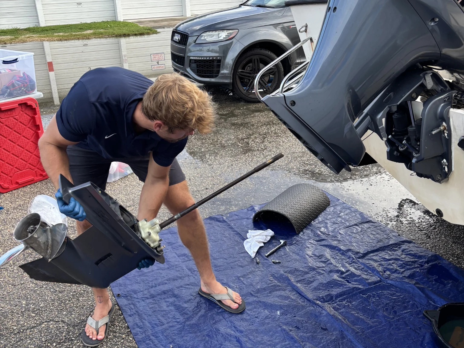 Outboard lower unit removed during annual maintenance