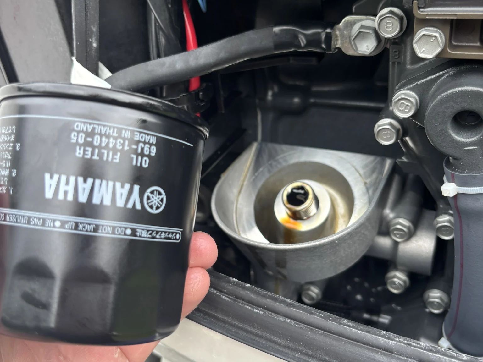Yamaha oil filter during a 100-hour outboard service